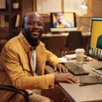 Portrait of African graphic designer in at WeAfrik connecting to listings and providers in the USA